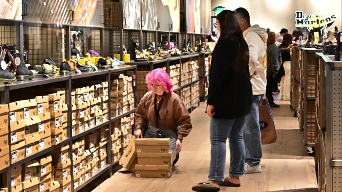 Customers shop at an outlet mall in Los Angeles, California